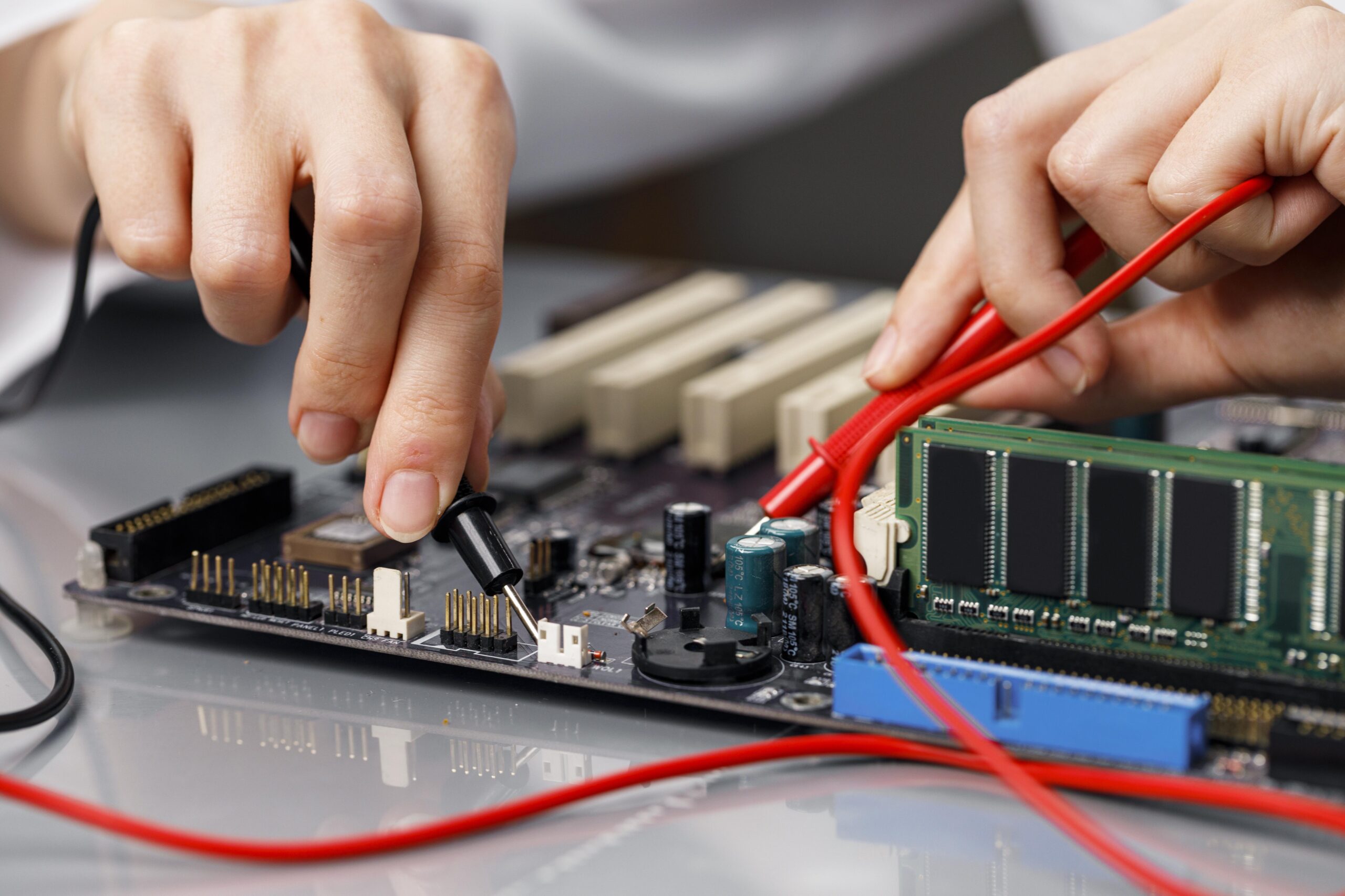 female-technician-repairing-computer-motherboard